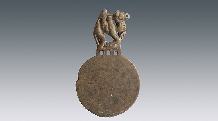 人骑骆驼纹柄青铜镜